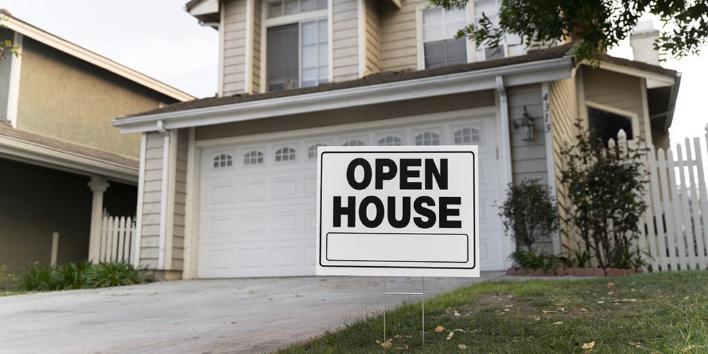 House with open house sign in front