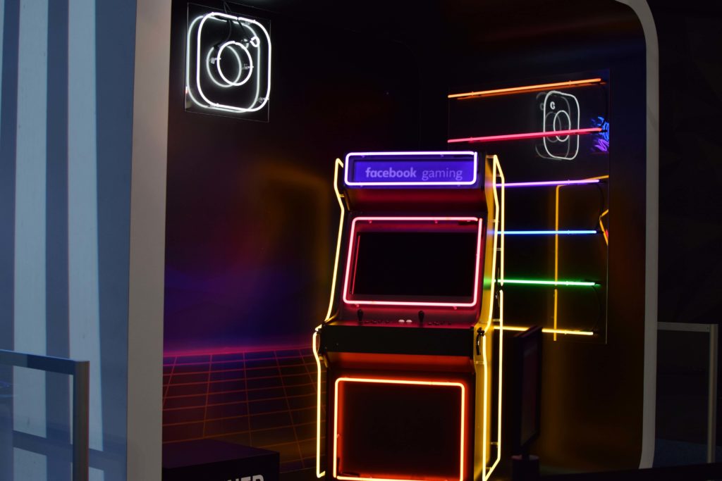 how to network on instagram, represented by a glowing instagram sign and a glowing arcade machine